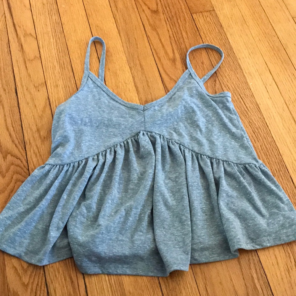 Cropped light blue heathered tank top.